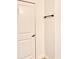Hallway with white walls, white door, and bronze towel bar at 860 Peachtree Ne St # 2616, Atlanta, GA 30308