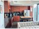Contemporary kitchen features stainless steel appliances, dark cabinets, island with seating, and city views at 860 Peachtree Ne St # 2616, Atlanta, GA 30308