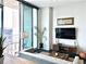 Bright living room with modern furnishings and a view from the balcony at 860 Peachtree Ne St # 2616, Atlanta, GA 30308