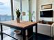 Well-lit living room with bar seating, neutral couch, and city views at 860 Peachtree Ne St # 2616, Atlanta, GA 30308