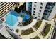 Rooftop pool area with lounge chairs and lush landscaping at 860 Peachtree Ne St # 2616, Atlanta, GA 30308