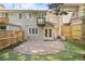 Back of house features a brick patio, fenced yard and walk-out balcony at 1209 Brookhaven Woods Ne Ct, Brookhaven, GA 30319