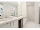 Bright bathroom featuring double vanity sinks and white tile at 1209 Brookhaven Woods Ne Ct, Brookhaven, GA 30319