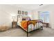 Stylish bedroom showcasing colorful accents and ample natural light at 1209 Brookhaven Woods Ne Ct, Brookhaven, GA 30319