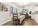 Bright dining area featuring modern decor, wood floors, and natural light at 1209 Brookhaven Woods Ne Ct, Brookhaven, GA 30319