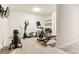 Well-equipped exercise room with an elliptical machine and adjustable weight bench at 1209 Brookhaven Woods Ne Ct, Brookhaven, GA 30319