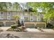 Townhome boasts a garage and landscaped front yard at 1209 Brookhaven Woods Ne Ct, Brookhaven, GA 30319