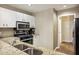 Modern kitchen with granite countertops and stainless steel appliances at 1209 Brookhaven Woods Ne Ct, Brookhaven, GA 30319