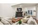 Bright living room with modern fireplace, neutral colors, and wood flooring at 1209 Brookhaven Woods Ne Ct, Brookhaven, GA 30319
