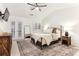 Serene main bedroom with hardwood floors, ceiling fan and natural light at 1209 Brookhaven Woods Ne Ct, Brookhaven, GA 30319