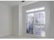 Bright bedroom featuring a large window that lets in natural light at 12554 Huntington Trce, Alpharetta, GA 30005