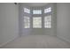 Bedroom with large windows and neutral carpet at 12554 Huntington Trce, Alpharetta, GA 30005