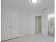 Bedroom with double closets, ensuite access and plush neutral-colored carpeting at 12554 Huntington Trce, Alpharetta, GA 30005