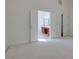 Spacious bedroom with a view of the bathroom and closet through an open door at 12554 Huntington Trce, Alpharetta, GA 30005