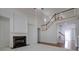 Elegant living room with fireplace and staircase at 12554 Huntington Trce, Alpharetta, GA 30005