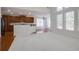 Open living space with hardwood floors, a breakfast bar, and plenty of natural light at 12554 Huntington Trce, Alpharetta, GA 30005