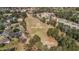 Aerial view of the home on a golf course, surrounded by mature trees, close to neighborhood at 3139 Players Dr, Jonesboro, GA 30236