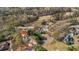 Aerial view of home on a golf course with mature trees and long driveway at 3139 Players Drive at 3139 Players Dr, Jonesboro, GA 30236