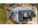 Aerial of the home's roof and partial surrounding landscape, featuring a long, winding driveway at 3139 Players Dr, Jonesboro, GA 30236