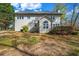Back exterior of home with a nice tree lined back yard at 3139 Players Dr, Jonesboro, GA 30236