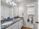 Bathroom featuring double sinks, granite countertops, and tile floors at 3139 Players Dr, Jonesboro, GA 30236