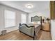 Bedroom with hardwood floors, natural light, and ample space at 3139 Players Dr, Jonesboro, GA 30236