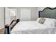 This bedroom has a luxurious bed, wood floors, and closet at 3139 Players Dr, Jonesboro, GA 30236