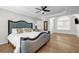 This bedroom boasts hardwood floors, natural light, and stylish decor at 3139 Players Dr, Jonesboro, GA 30236