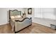 This bedroom features beautiful hardwood floors and a unique headboard design at 3139 Players Dr, Jonesboro, GA 30236