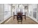 Bright dining area with wood floors and large windows offering ample natural light at 3139 Players Dr, Jonesboro, GA 30236
