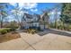 Spacious home with an attached two-car garage and a long driveway at 3139 Players Dr, Jonesboro, GA 30236