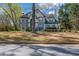 Charming two-story home with a well-manicured front yard and mature trees at 3139 Players Dr, Jonesboro, GA 30236
