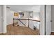 Spacious hallway with hardwood floors and railing overlooking the staircase at 3139 Players Dr, Jonesboro, GA 30236