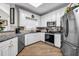 Modern kitchen featuring granite countertops and stainless steel appliances, ample storage at 3139 Players Dr, Jonesboro, GA 30236
