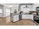 Modern kitchen with granite countertops, stainless appliances, and hardwood flooring at 3139 Players Dr, Jonesboro, GA 30236