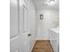 Bright laundry room with wood floors, modern appliances, and ample storage space at 3139 Players Dr, Jonesboro, GA 30236