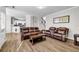 Bright living room with hardwood floors, comfortable seating, and an open floor plan at 3139 Players Dr, Jonesboro, GA 30236