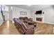 Well-lit living room featuring hardwood floors, a fireplace, and comfortable seating at 3139 Players Dr, Jonesboro, GA 30236