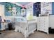 Bright bedroom with blue walls, a white bed, and playful decor perfect for a  at 561 Valleyside Dr, Dallas, GA 30157