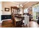 Traditional dining room with a wooden table, china cabinet, and natural light at 561 Valleyside Dr, Dallas, GA 30157