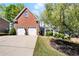 Inviting two-story brick home with a two-car garage and manicured lawn at 561 Valleyside Dr, Dallas, GA 30157