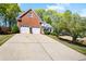 Charming two-story brick home featuring a two-car garage and well-maintained landscaping at 561 Valleyside Dr, Dallas, GA 30157