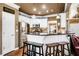Modern kitchen with white cabinets, stainless steel appliances, and breakfast bar seating at 561 Valleyside Dr, Dallas, GA 30157