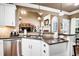 Modern kitchen features stainless steel appliances, granite countertops, and an open layout to the living area at 561 Valleyside Dr, Dallas, GA 30157