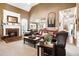 Bright living room featuring a fireplace, vaulted ceilings, and comfortable leather furniture at 561 Valleyside Dr, Dallas, GA 30157