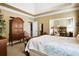 Spacious bedroom with a tray ceiling, neutral carpet, a walk-in closet, and ample natural light at 561 Valleyside Dr, Dallas, GA 30157