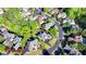 A stunning aerial view showcasing the home's private pool and mature landscaping in a serene neighborhood setting at 7080 Greatwood Trl, Alpharetta, GA 30005