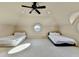 Spacious bedroom featuring two beds, neutral decor, and ample natural light at 7080 Greatwood Trl, Alpharetta, GA 30005
