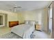 This bright bedroom features neutral walls, carpeted floors, and two large windows for plentiful natural light at 7080 Greatwood Trl, Alpharetta, GA 30005