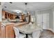 Bright kitchen features an island with granite countertop, custom cabinetry, and stainless steel appliances at 7080 Greatwood Trl, Alpharetta, GA 30005
